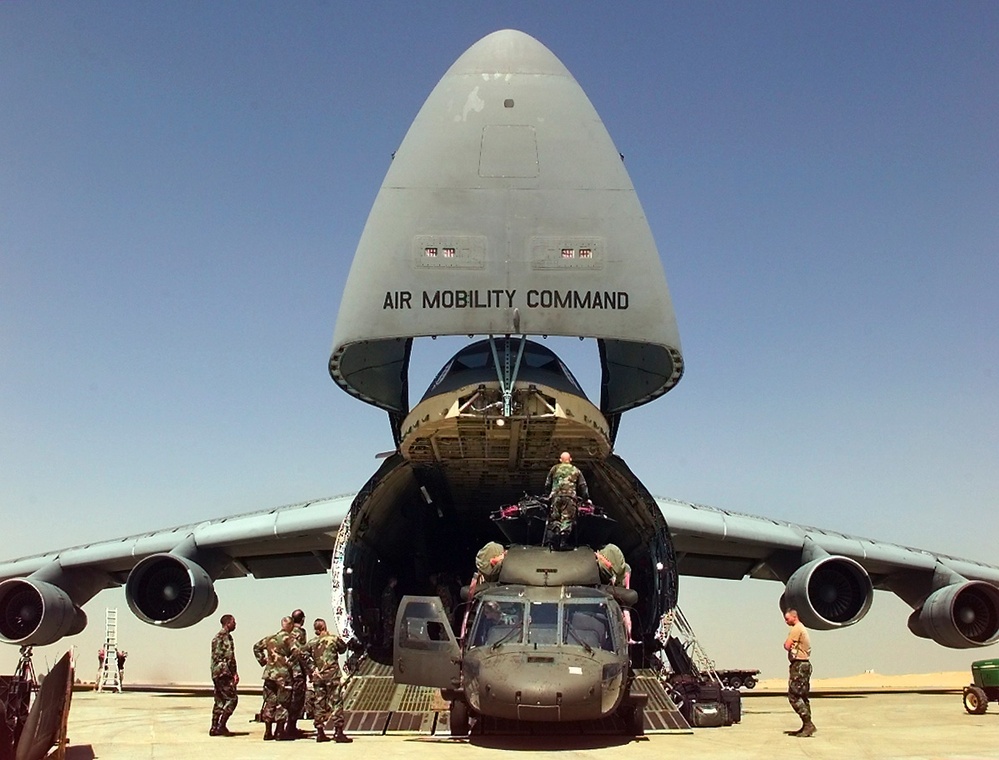 U.S. Army personnel unload their UH-60L Black Hawk helicopters from a U.S. Air Force C-5 Galaxy at Cairo West.