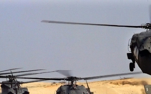 U.S. Army UH-60L Black Hawk helicopters lift off at Cairo West Air Base, Egypt, during Exercise Bright Star.