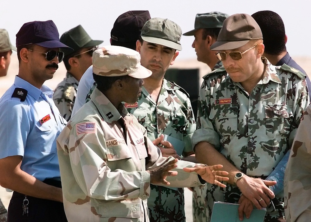 Capt. Erika Dance-Walker, U.S. Army, explains the Patriot Missile system to coalition military members.