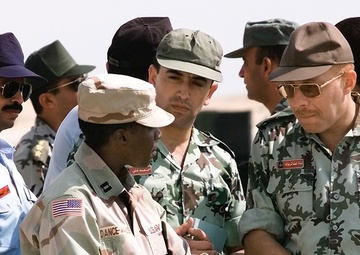 Capt. Erika Dance-Walker, U.S. Army, explains the Patriot Missile system to coalition military members.