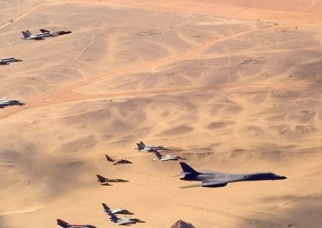 A B-1B Lancer bomber leads a flight of Egyptian, French, Greek, Italian and U.S. aircraft over the Great Pyramids.