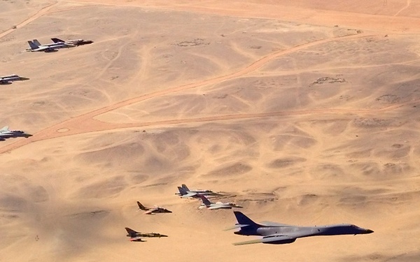A B-1B Lancer bomber leads a flight of Egyptian, French, Greek, Italian and U.S. aircraft over the Great Pyramids.