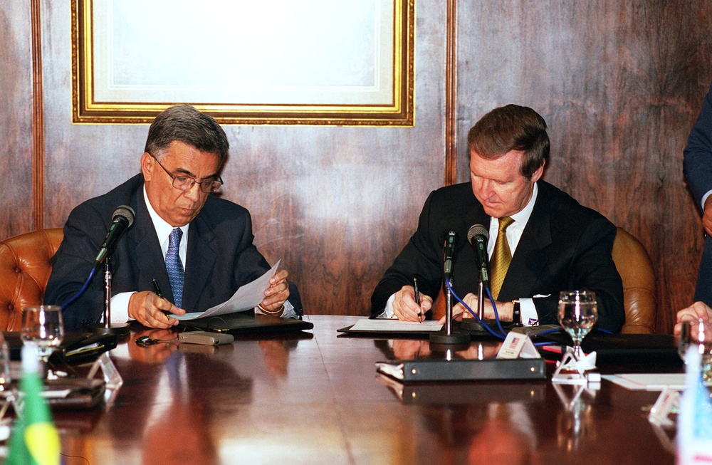 Minister of Defense Elcio Alvares and Secretary Cohen sign a Bilateral Working Group Agreement in Brasilia, Brazil.