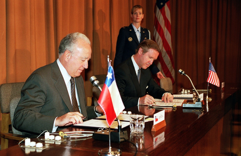 Minister of Defense Edmundo Perez Yoma and Secretary Cohen sign a Joint Statement on Defense Environmental Cooperation.