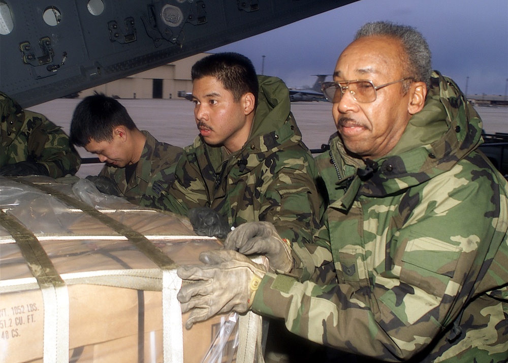 Airmen push a pallet of cargo aboard a C-17 Globemaster en route to South Africa for Operation Atlas Response.