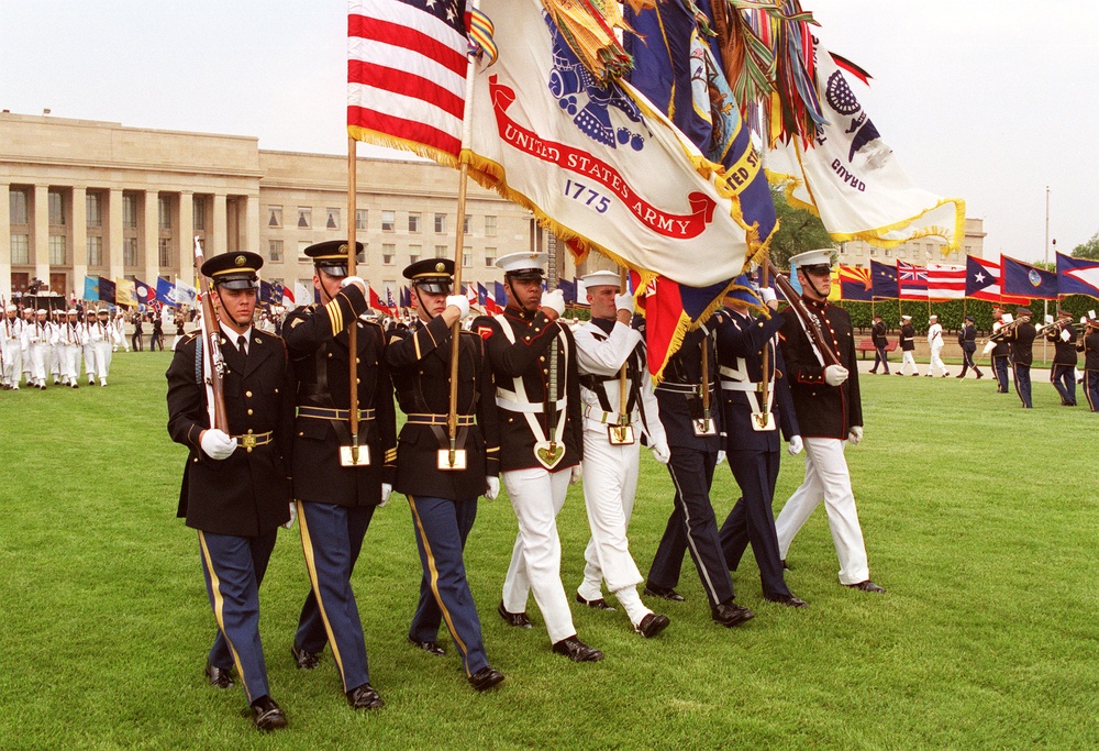 The Joint Service Color Guard passes in review during the 50th Anniversary of Armed Forces Day ceremony at the Pentagon.