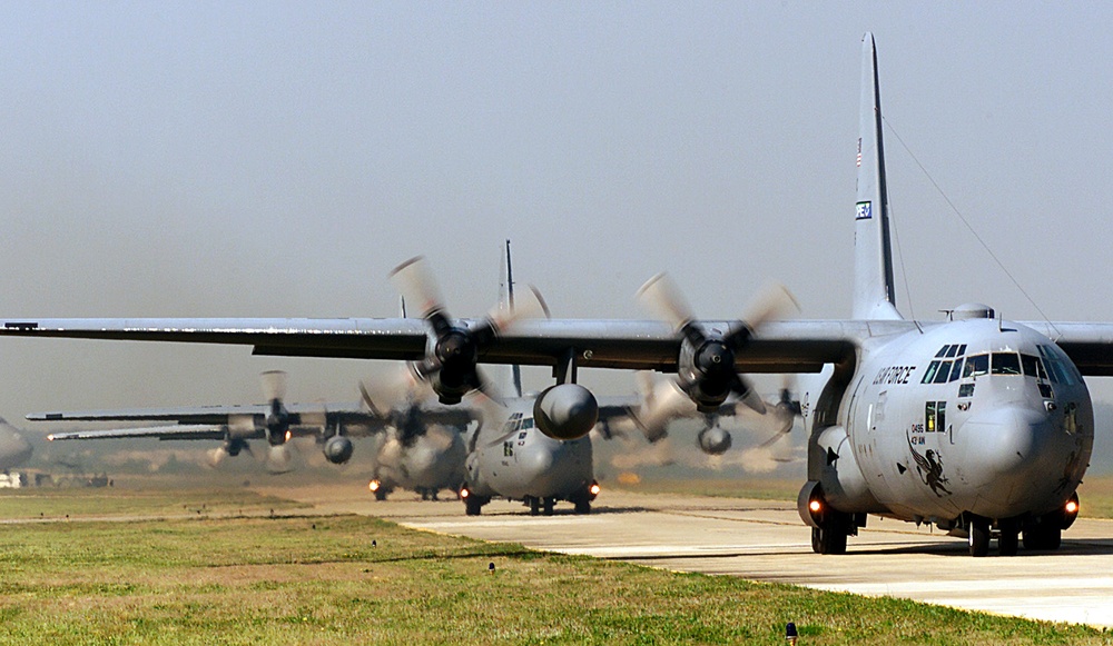 C-130 Hercules taxi down the runway at Pope prior to loading up paratroopers for an airdrop during Rodeo 2000.