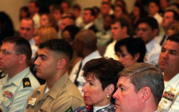 An audience of military family members listens to remarks by Secretary Cohen at the first annual Military Family Forum.