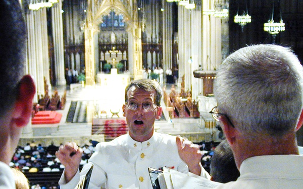 Chief Musician Hinton directs the U.S. Navy Sea Chanters Chorus during a mass at St. Patrick's Cathedral in New York.