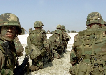 Sgt. Ronnie Guerra and other U.S. Marines prepare for a simulated attack on Vadu Beach, Romania, during Exercise Rescue Eagle 2000.