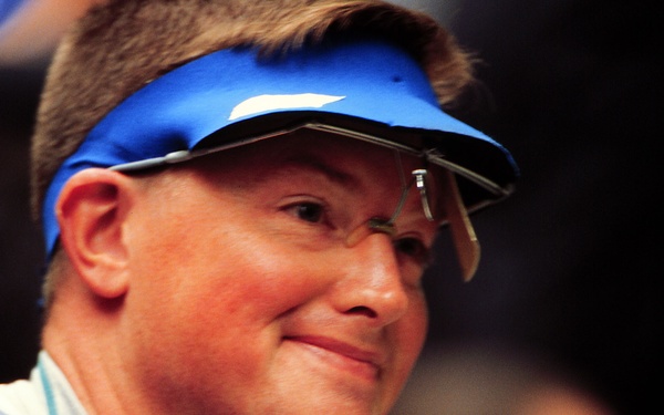 Army Staff Sgt. Kenneth A. Johnson looks to the scoreboard after he failed to make the final round in the men's 10 meter air rifle.