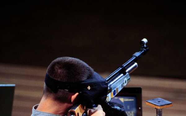 Sgt. Jason A. Parker, U.S. Army, aims down range as he competes in the men's 10 meter air rifle competition.