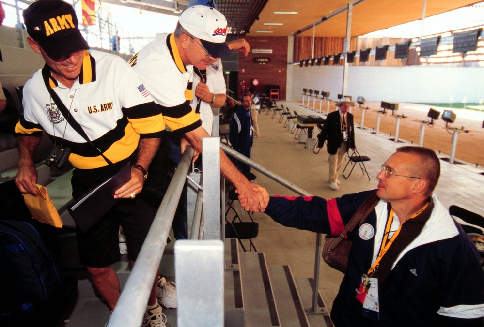 Army Sgt. 1st Class Daryl L. Szarenski shakes hands with Col. Arch V. Arnold III after competing in the 2000 Olympic Games.