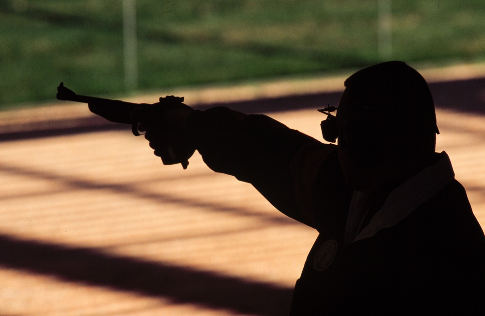 Army Sgt. 1st Class Daryl L. Szarenski shoots during the 50 meter air pistol competition at the 2000 Olympic Games.