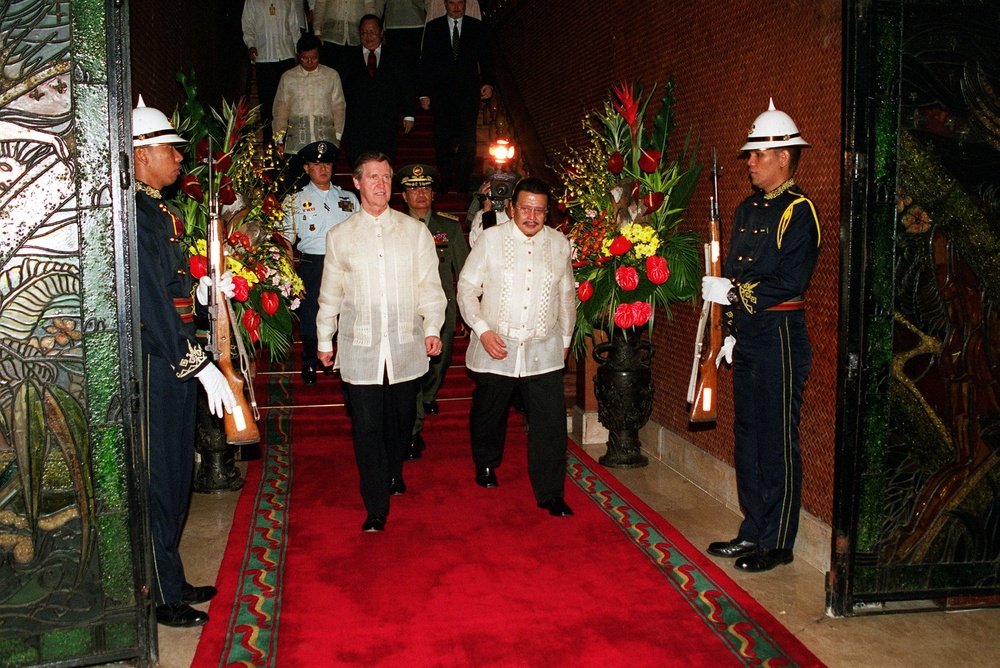 President Joseph Estrada escorts Secretary Cohen as he departs Malacanang Palace.