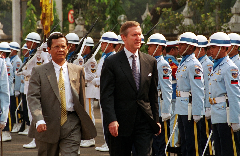Minister of Defense Mahfud Mahmudin escorts Secretary Cohen as he inspects the troops at the Defense Ministry in Jakarta.