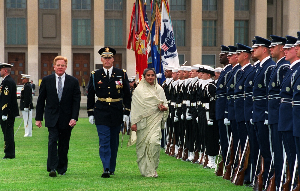 Prime Minister Sheikh Hasina, of the Peoples Republic of Bangladesh, inspects the ceremonial honor guard at the Pentagon.