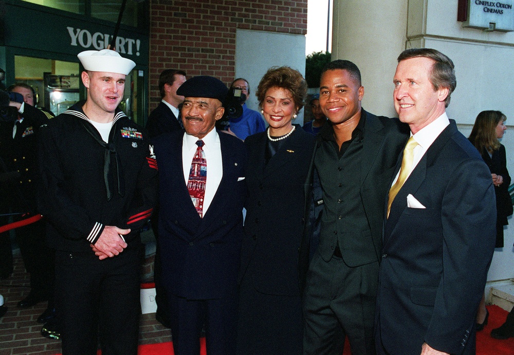 Guests of honor pose for pictures at a special premiere screening of the Twentieth Century Fox film "Men of Honor."