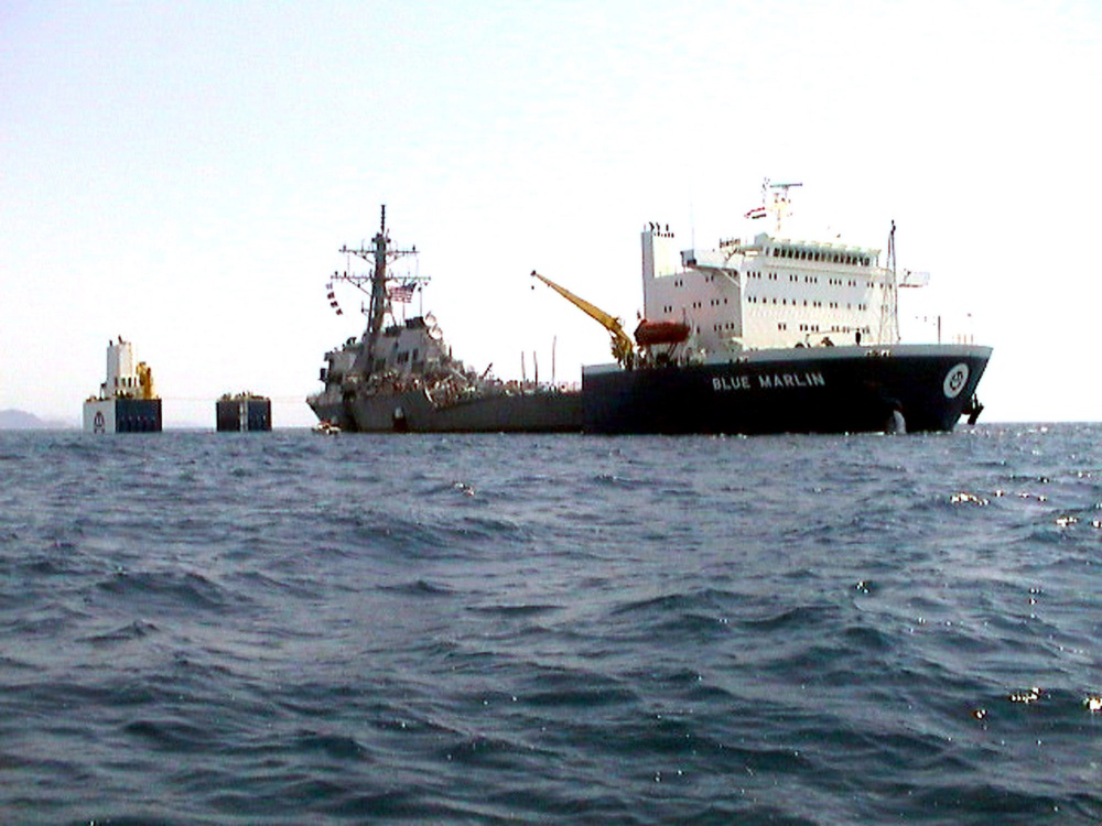 The USS Cole is slowly lifted from the water by the Norwegian heavy transport ship M/V Blue Marlin off the coast of Aden, Yemen.