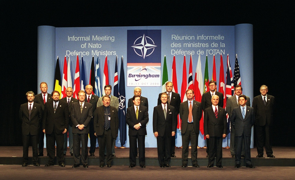 Defense ministers of NATO nations pose as a group at the Informal Meeting of NATO Defense Ministers in Birmingham, England.