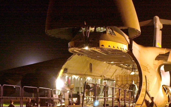 U.S. Air Force personnel unload relief supplies destined for earthquake victims in India.