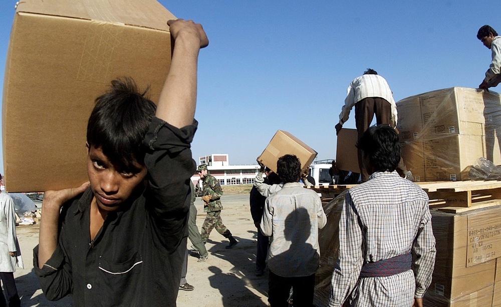 Pallets of humanitarian relief supplies from the U.S. are unloaded at Ahmadabad, India.
