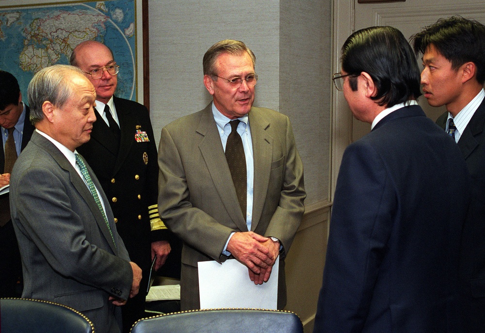 Secretary Rumsfeld talks to Japanese Senior Vice Minister of Foreign Affairs Seishiro Eto in the Pentagon.