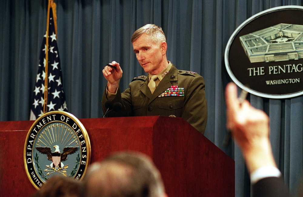 Lt. Gen. Gregory S. Newbold takes questions from reporters at the Pentagon regarding air strikes against Iraq.