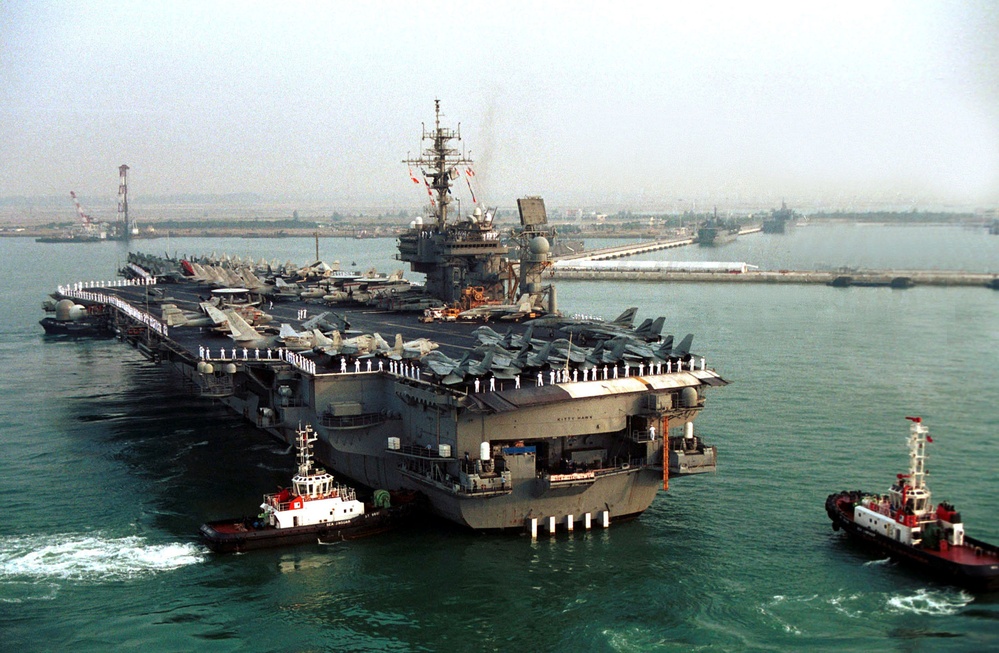 DVIDS - Images - Tug boats push the USS Kitty Hawk (CV 63) towards