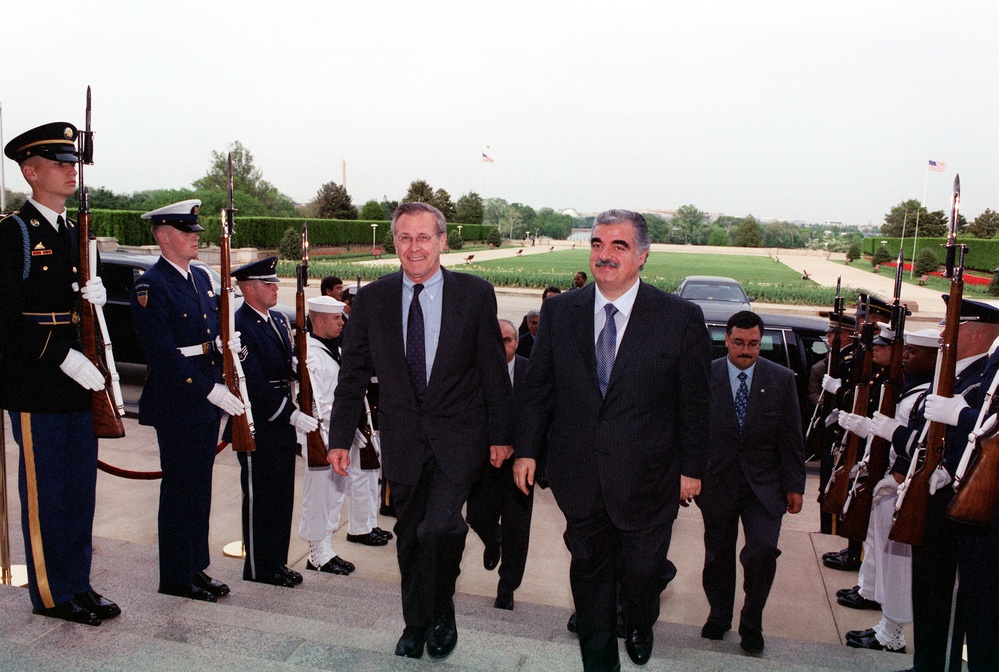 Secretary Rumsfeld escorts Lebanese Prime Minister Rafiq Hariri into the Pentagon.