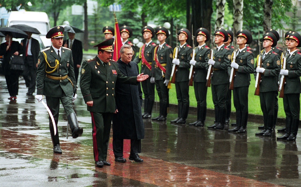 Secretary Rumsfeld is welcomed with full military honors by Ukrainian Minister of Defense Gen. Kuzmuk in Kiev.