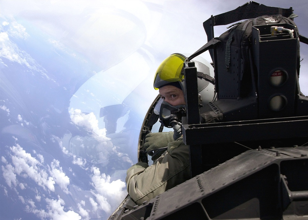 Maj. Jim Shaw banks his F-15D Eagle as he looks for opposition aircraft while flying a training mission over the Pacific.