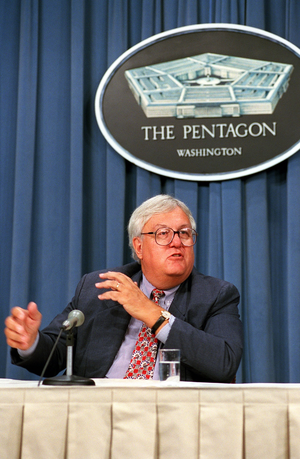 Assistant Secretary of Defense John P. Stenbit answers reporters' questions in the Pentagon.