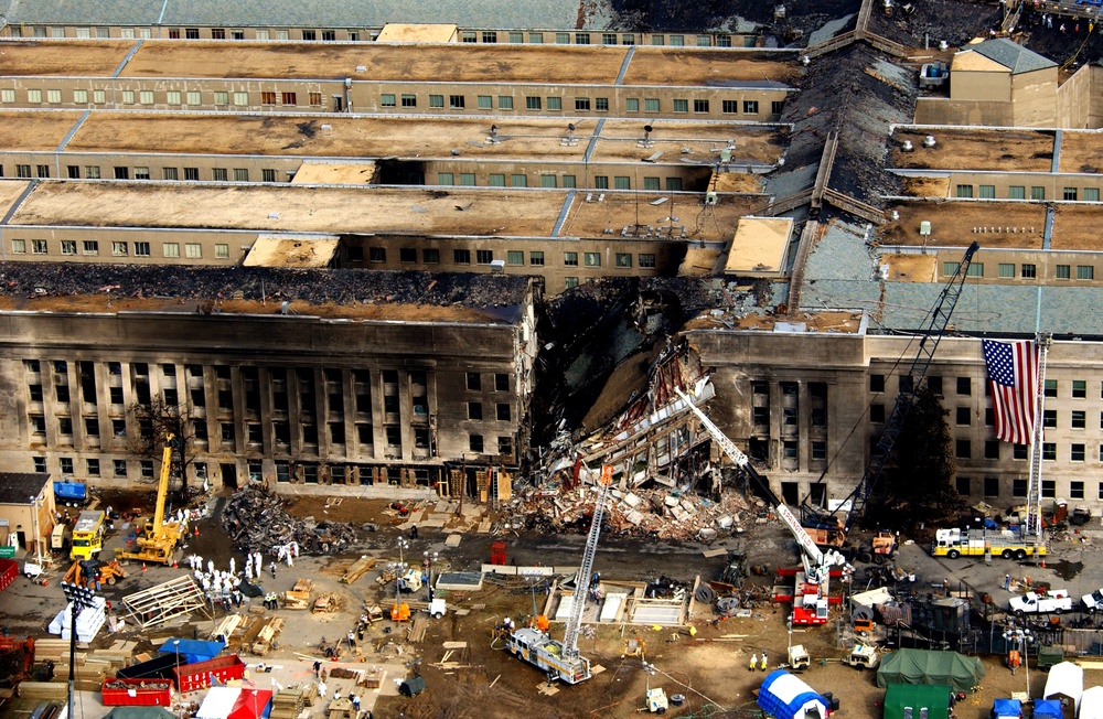 FBI agents, fire fighters, rescue workers and engineers work at the Pentagon crash site.