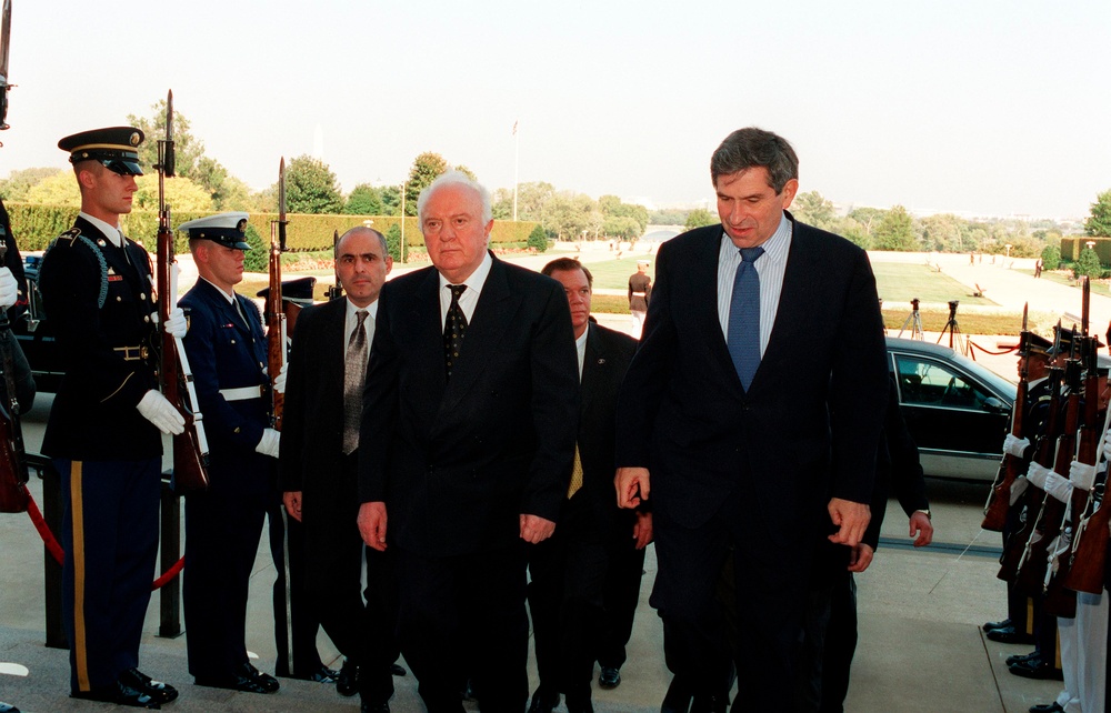 Georgian President Eduard Shevardnadze is escorted into the Pentagon by Deputy Secretary Wolfowitz.