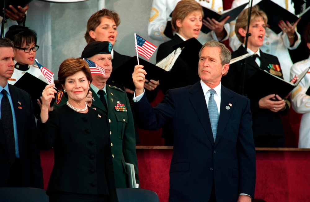 DVIDS - Images - President Bush and first lady Laura Bush wave the flag ...