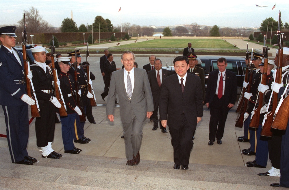 Secretary Rumsfeld escorts visiting Prime Minister Shinawatra into the Pentagon.
