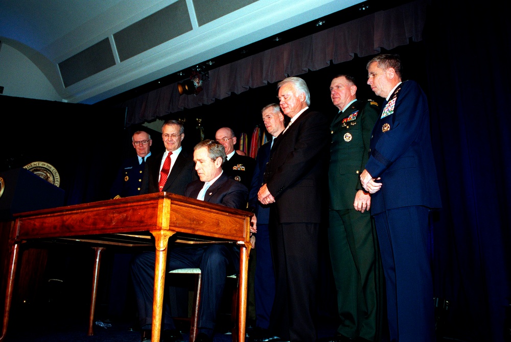 President George W. Bush signs the Defense Appropriations Bill at the Pentagon.