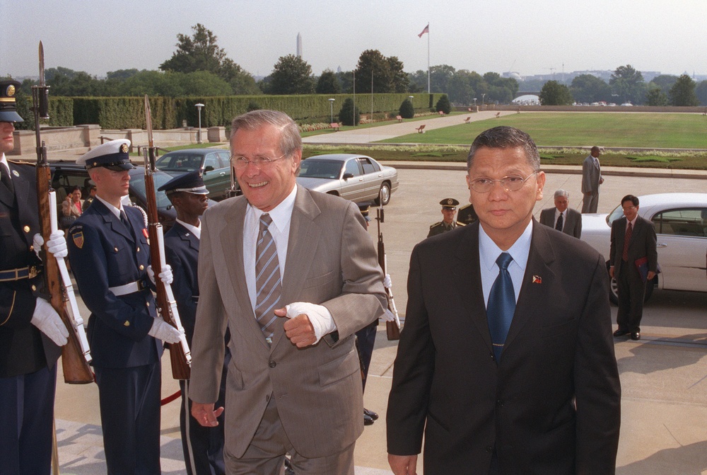 Secretary Rumsfeld escorts Minister of National Defense Angelo Reyes into the Pentagon.