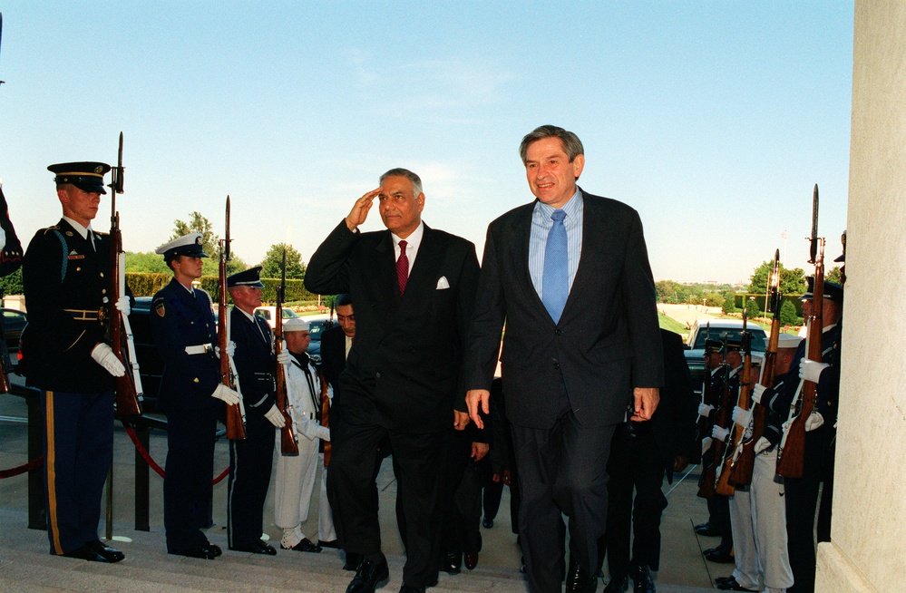 Minister of Foreign Affairs Yashwant Sinha of India is escorted into the Pentagon by Deputy Secretary Wolfowitz.