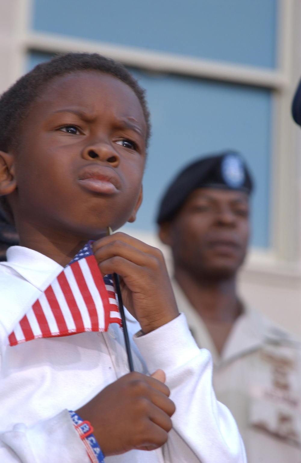 Ten year old Andre Hinton holds an American flag during the Pentagon Remembrance Ceremony.