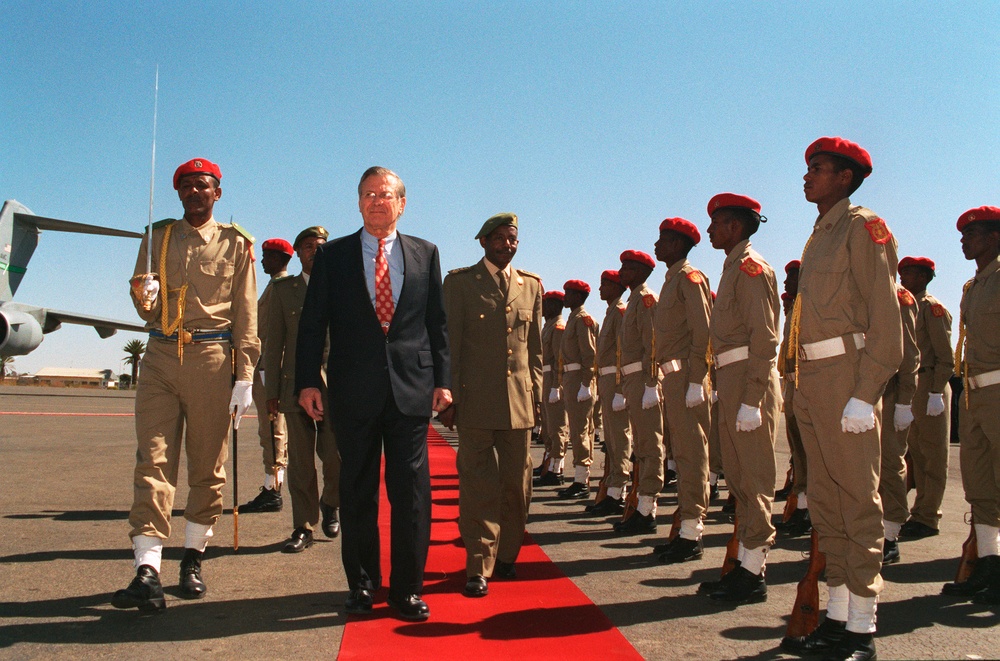 Secretary Rumsfeld and Minister of Defense Gen. Ephraim inspect troops during a welcoming ceremony.