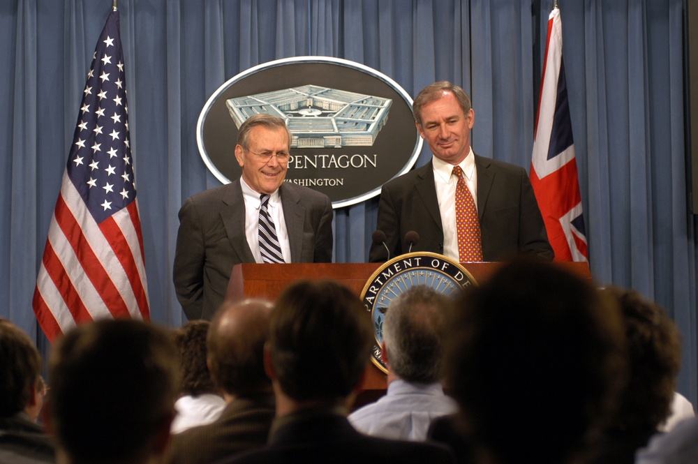 Secretary Rumsfeld and Secretary of State for Defence Geoffrey Hoon listen to a question during a press conference in the Pentagon.