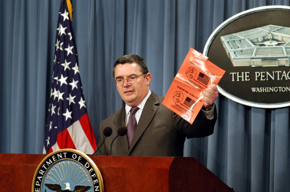 Deputy Assistant Secretary of Defense Joseph Collins shows the new vinyl wrapper for HDRs at a Pentagon briefing.