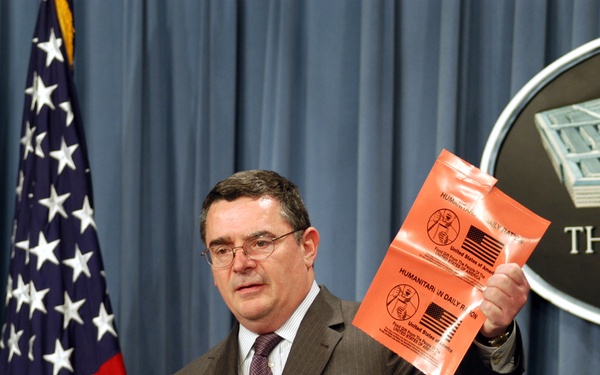 Deputy Assistant Secretary of Defense Joseph Collins shows the new vinyl wrapper for HDRs at a Pentagon briefing.