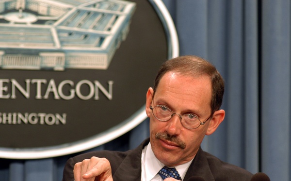 Under Secretary of Defense Dov Zakheim gestures to emphasize his point during a Pentagon press conference.