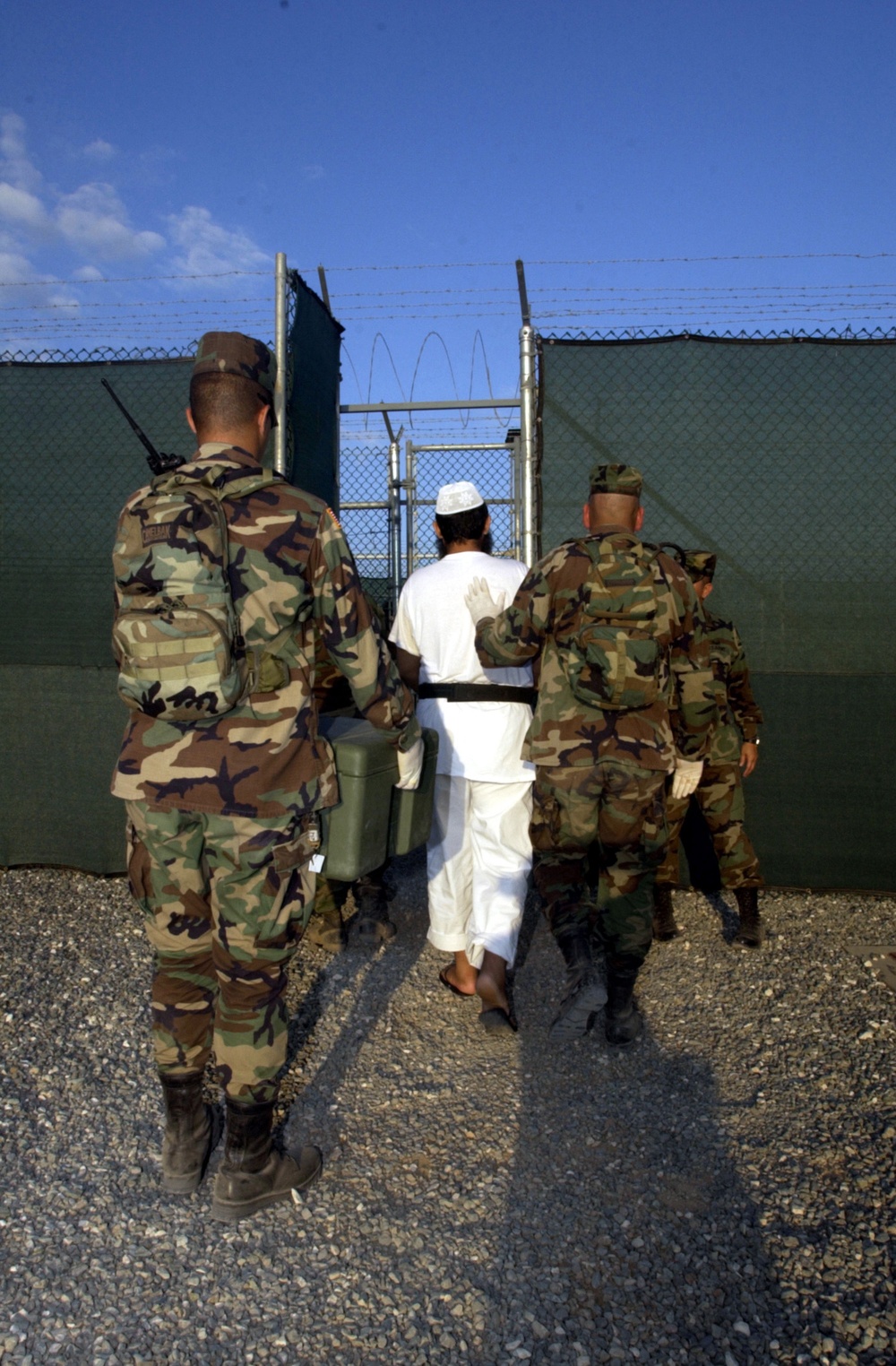 A detainee is escorted to a medium security facility at Guantanamo Bay.