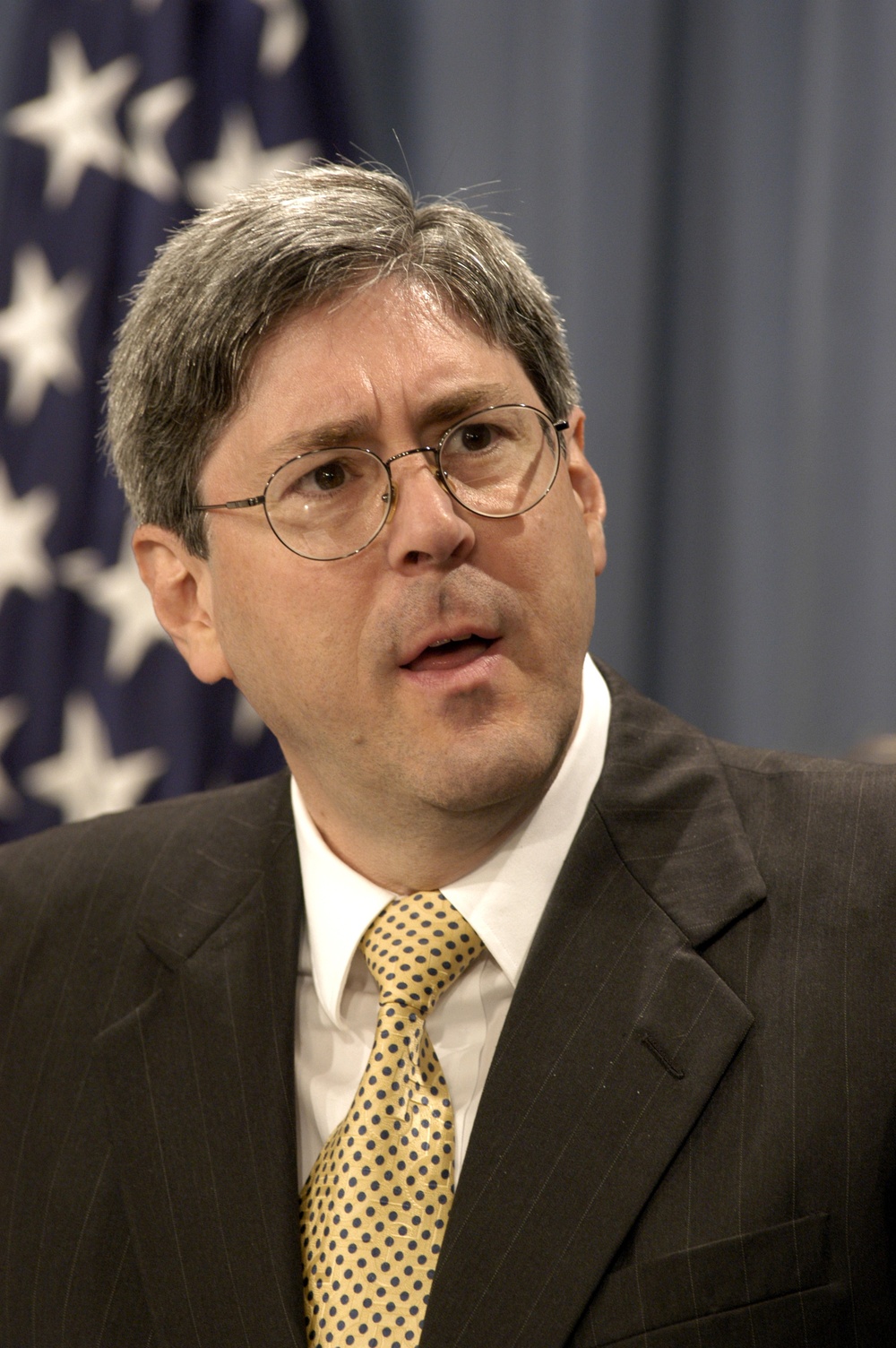 Under Secretary of Defense for Policy Douglas Feith briefs news reporters on the reconstruction of Iraq.