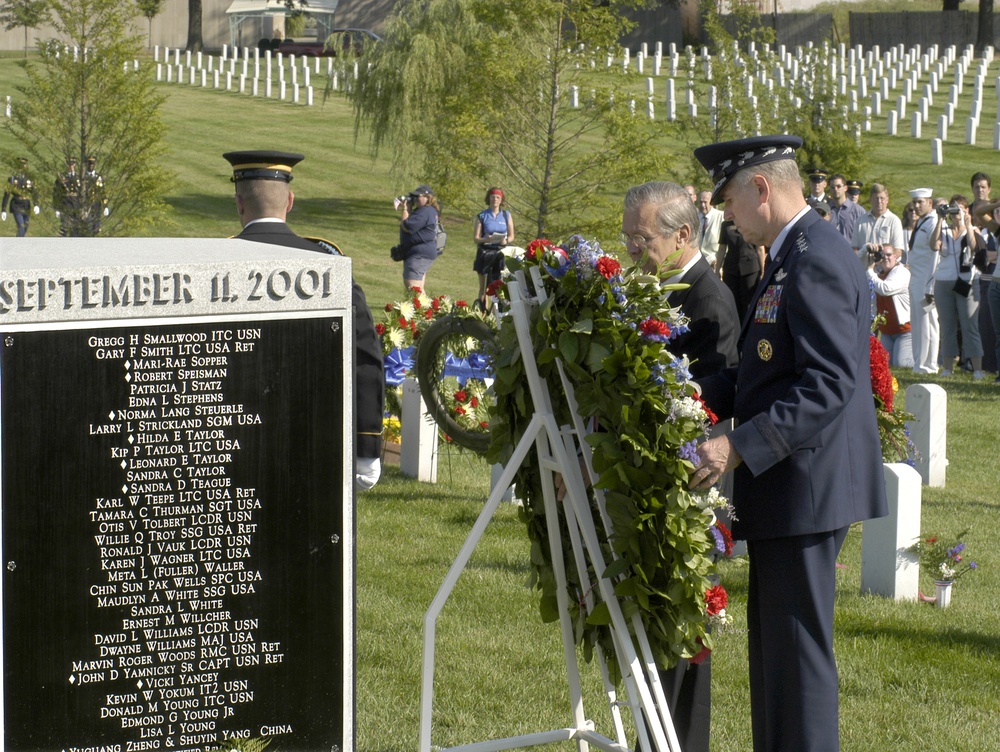 Secretary Rumsfeld and Gen. Myers place a memorial wreath at the monument to the victims of the terrorist attack on the Pentagon.