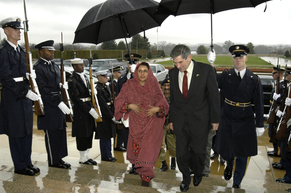 Deputy Secretary Wolfowitz talks with Pakistani Minister of Education Zubaida Jala Khan as he escorts her into the Pentagon.